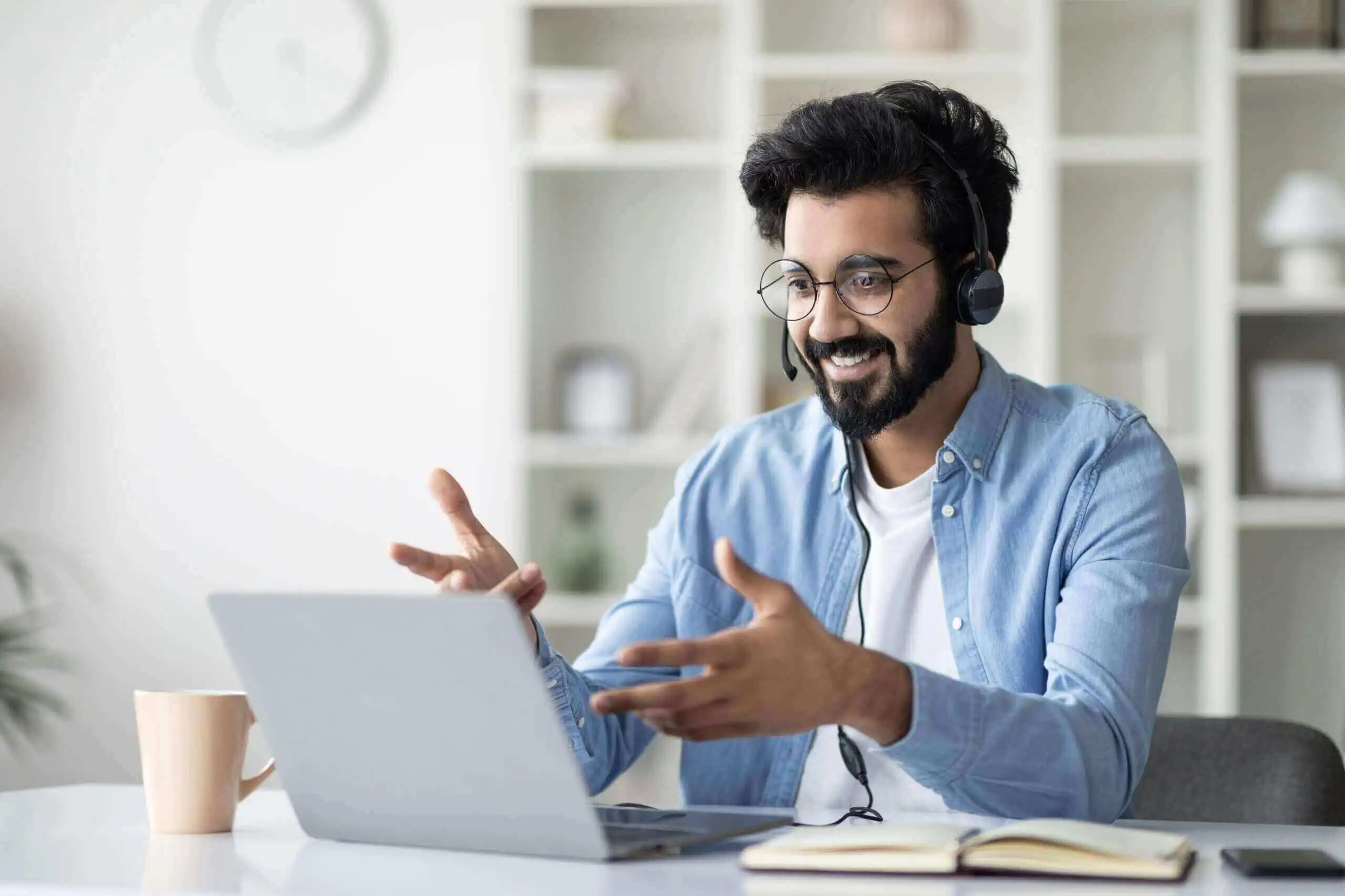 online-coaching-indian-male-tutor-making-video-call-with-laptop-headset-scaled (1) (1) (1)