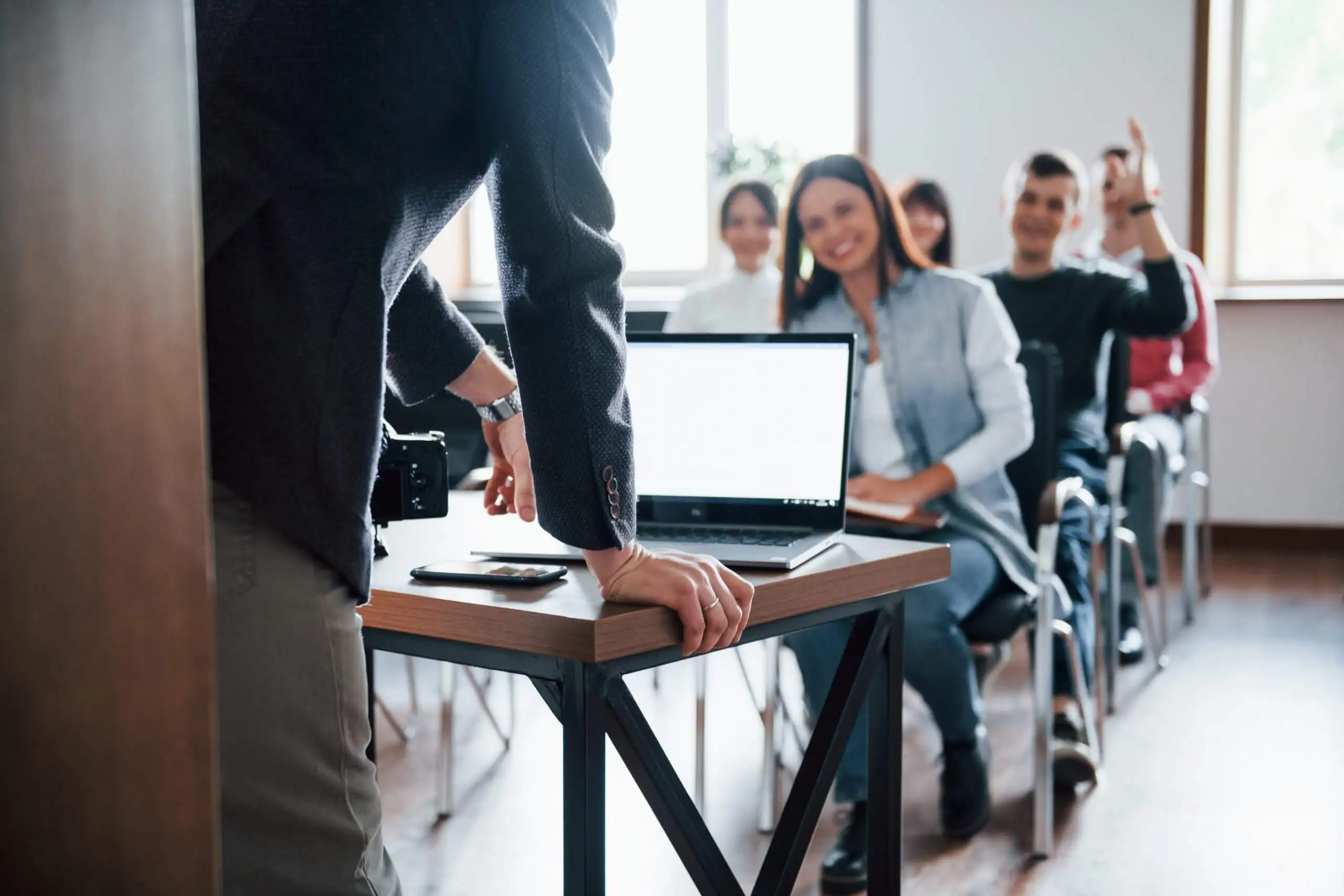 man-have-question-hand-raised-up-group-people-business-conference-modern-classroom-daytime-scaled (1)